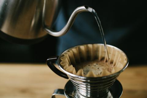 Pour over pours coffee